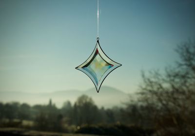 Close-up of pendant against clear sky