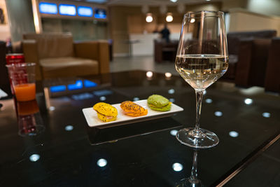 Glass of drink on table at restaurant