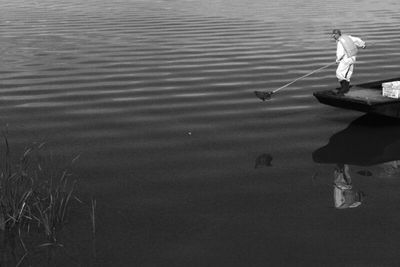 Reflection of woman in water