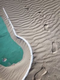 High angle view of sand on beach