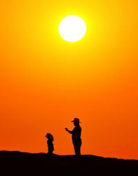 Silhouette of playing at sunset