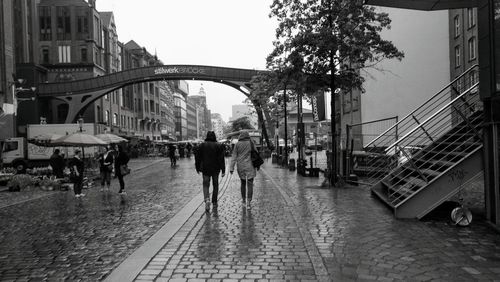 People walking on street in city