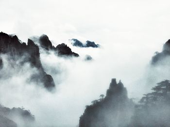 Scenic view of fog and mountains