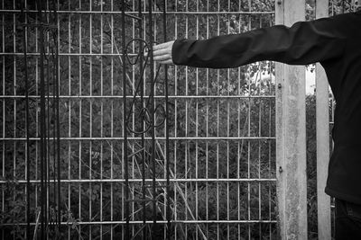 Man hand on metal grate