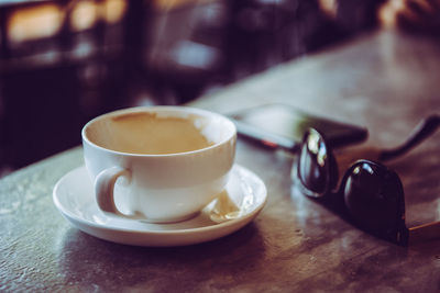 Close-up of coffee cup on table