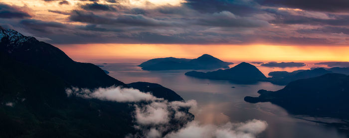 Scenic view of mountains against sky during sunset