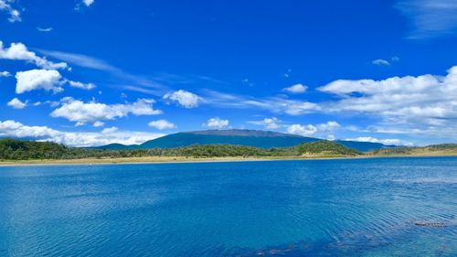 Scenic view of sea against blue sky