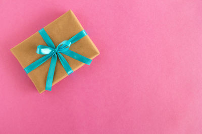 Directly above shot of paper box against colored background