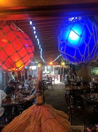 Illuminated lanterns hanging at night