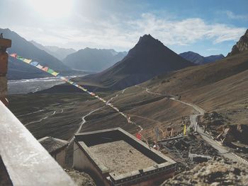 Aerial view of mountain range against cloudy sky