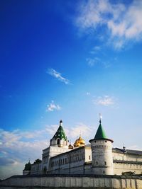 Low angle view of building against blue sky