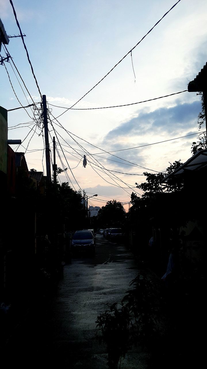 power line, electricity pylon, cable, electricity, power supply, connection, sunset, silhouette, sky, power cable, built structure, fuel and power generation, transportation, dusk, low angle view, street light, building exterior, architecture, clear sky, outdoors