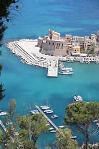 High angle view of buildings by sea