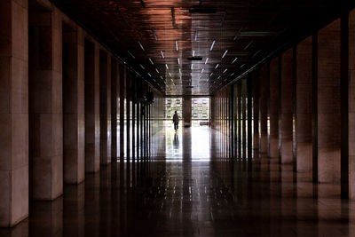 Long empty corridor along walls