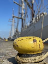 Close-up of yellow rope on pier