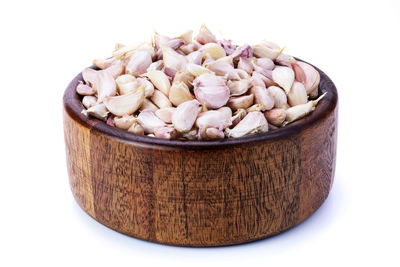 Close-up of chocolate in bowl against white background