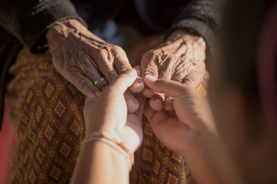 Midsection of woman with hands