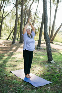 Full length of woman standing on field