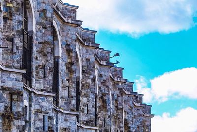 Low angle view of built structure against blue sky