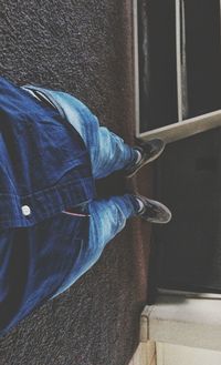 Low section of man standing on floor