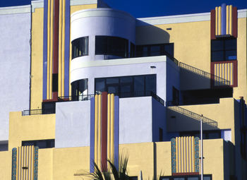 Low angle view of building against clear blue sky