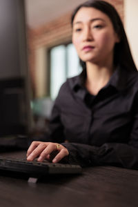 Young woman using laptop at home