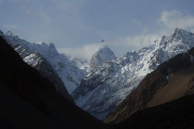 Scenic view of snowcapped mountains against sky