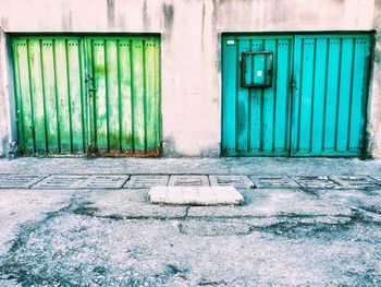 Closed doors of building by road