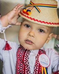 Close-up portrait of cute boy in traditional clothing