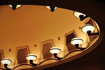 Low angle view of illuminated lamp at home