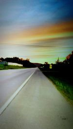 Road against sky at sunset