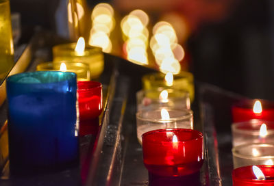 Candles inside a church. sensation of religiosity and tranquility. bokeh lights as space for text