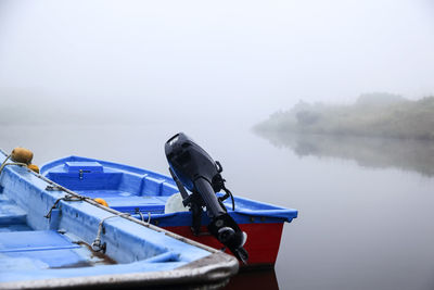 Scenic view of calm lake against cloudy sky