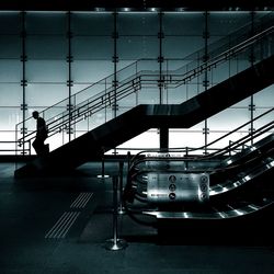 Escalator with staircase at subway station