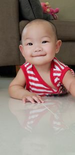 Portrait of cute baby girl at home