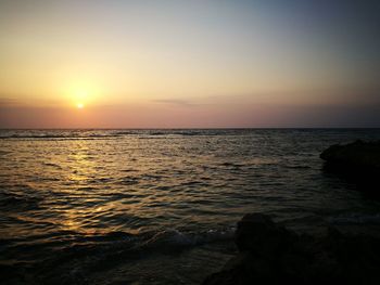 Scenic view of sea at sunset