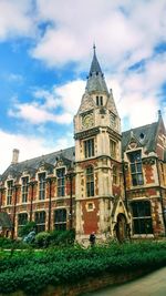 Low angle view of historical building against cloudy sky