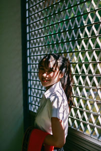 Portrait of a smiling girl standing outdoors