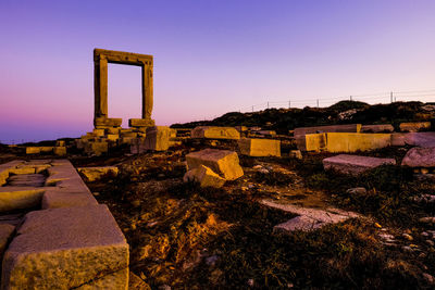 Sunrise illuminating the portara ruins on the greek island of naxos