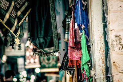 Low angle view of clothes hanging at market stall