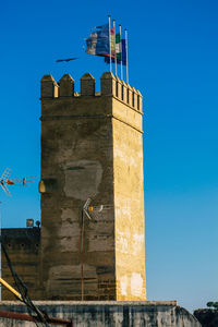 Low angle view of historical building against blue sky