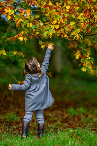Portrait of girl standing on field
