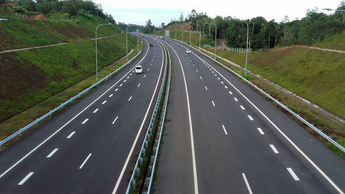 Aerial view of highway amidst trees