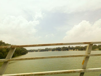 View of railing against cloudy sky