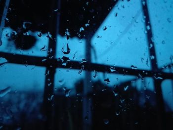 Full frame shot of wet glass window in rainy season