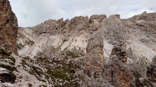 Low angle view of rocks on land against sky