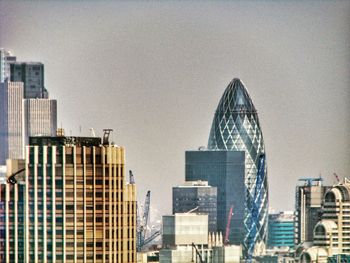 Modern buildings against sky in city