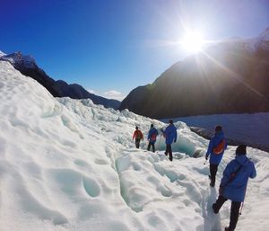 Rear view of tourists on mountain