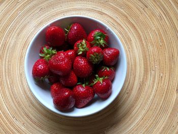 High angle view of strawberries in bowl on table