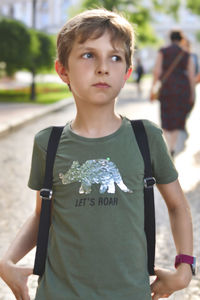 Portrait of teenage boy standing outdoors